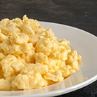 Scrambled eggs on a white plate