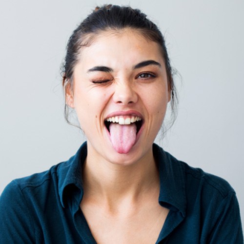 Woman winking and sticking out her tongue