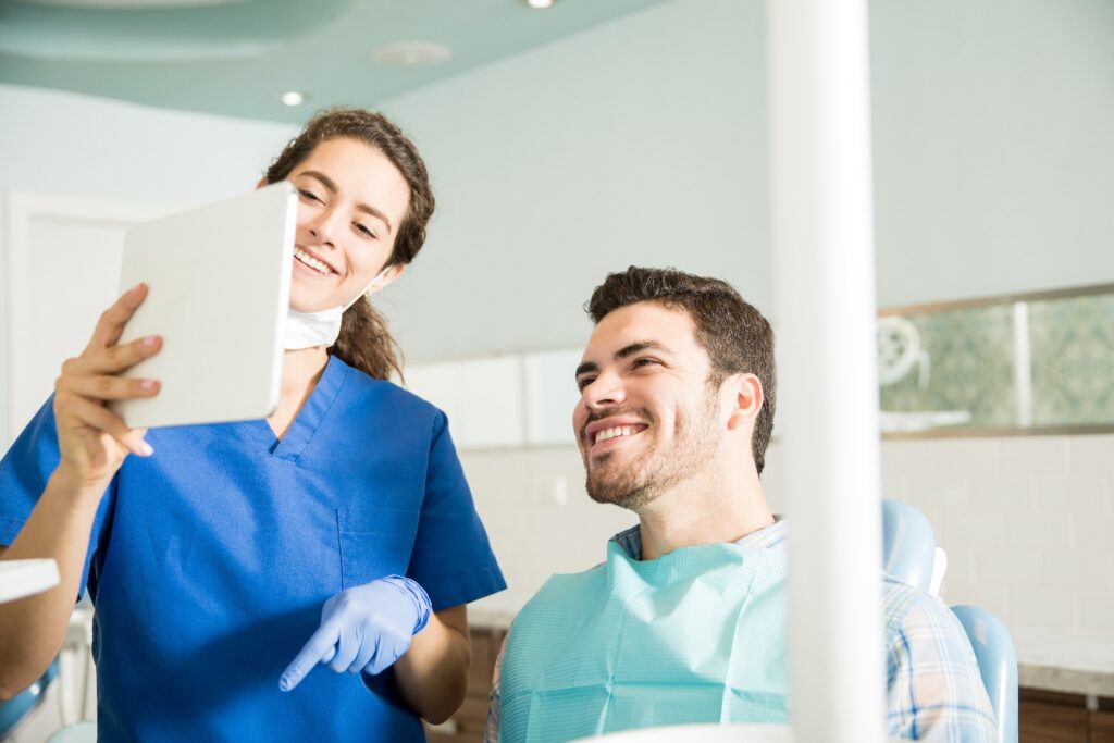 Man receives explanation from dentist